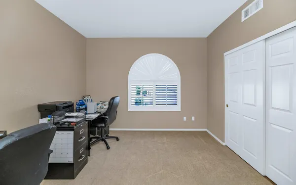 a front view of a house with a yard table and chairs