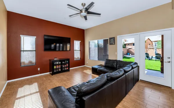 a view of a living room hardwood and kitchen
