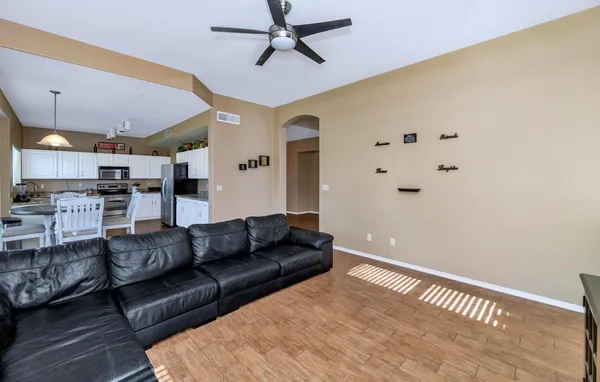 a living room with furniture and a window