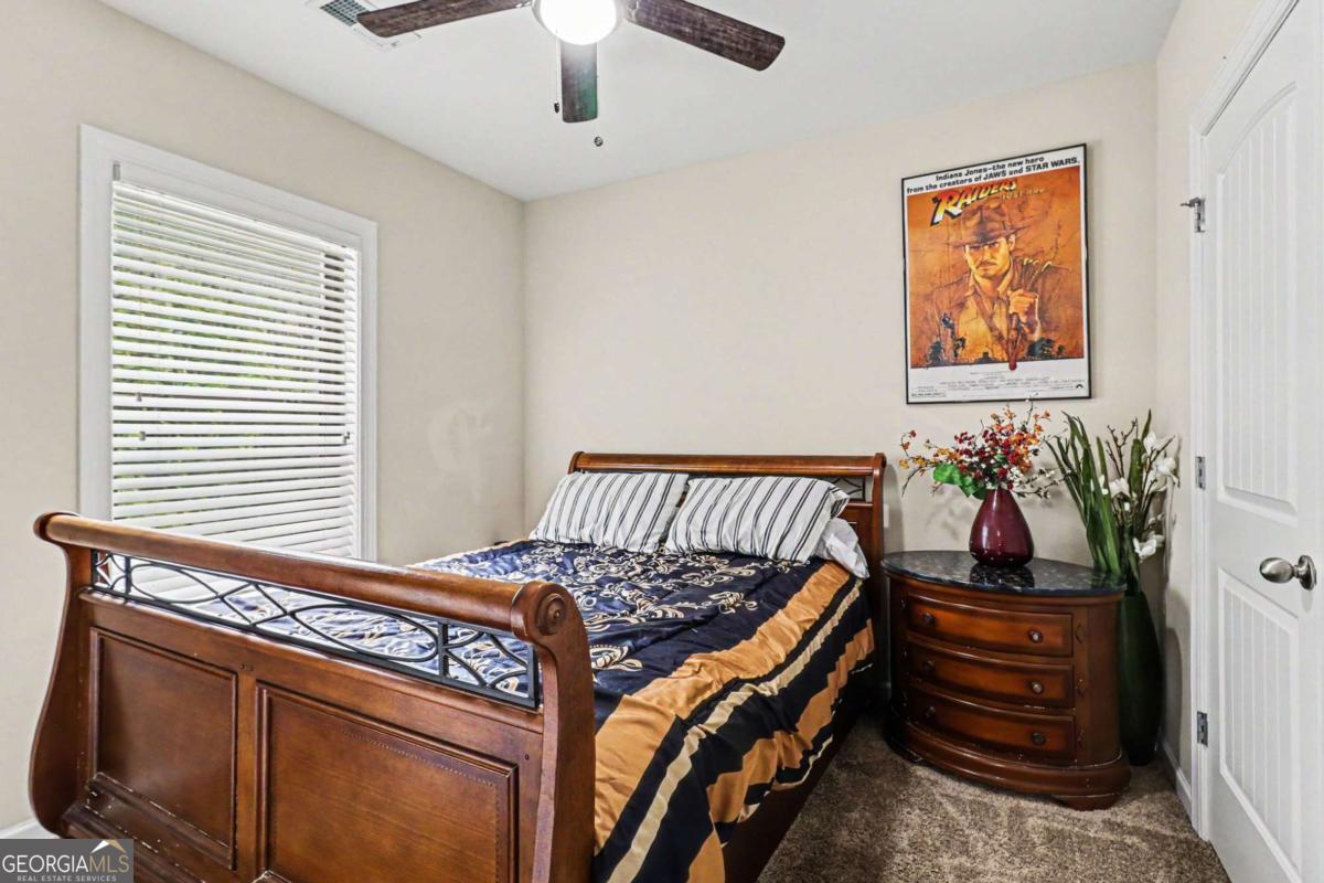 207 George Wynn Road Palmetto, GA 30268 - Photo 19 of 32 a bed room with a bed and a window