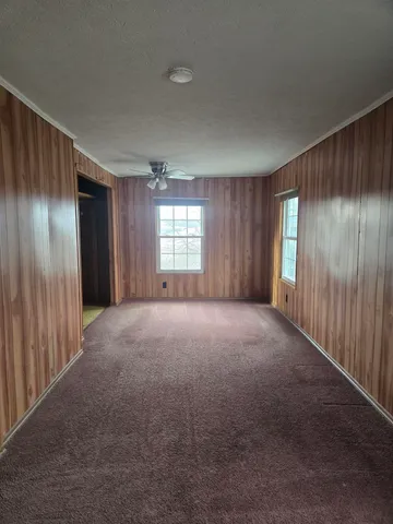 a view of an empty room with windows