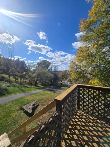 a balcony view with a garden space