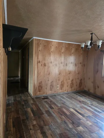 a view of a room with wooden walls