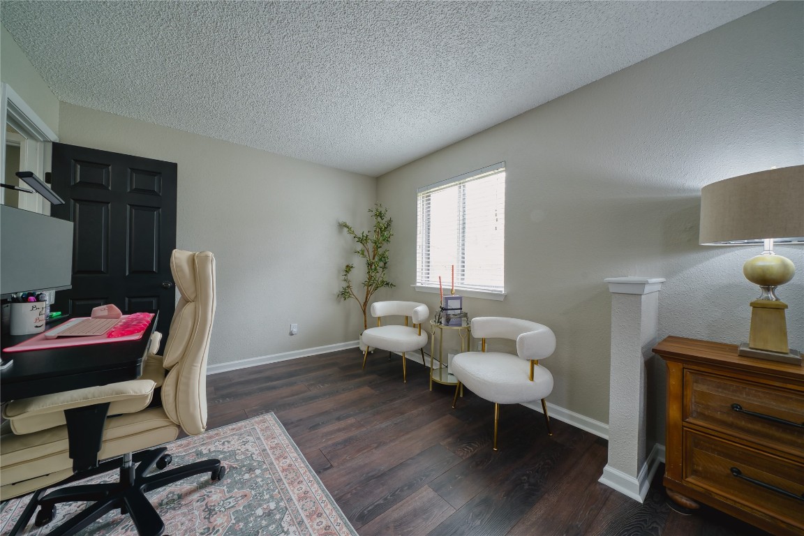 5402 Sherrylee Lane Spring, TX 77373 - Photo 16 of 24 The master bedroom with a home office setup and bright, natural light.