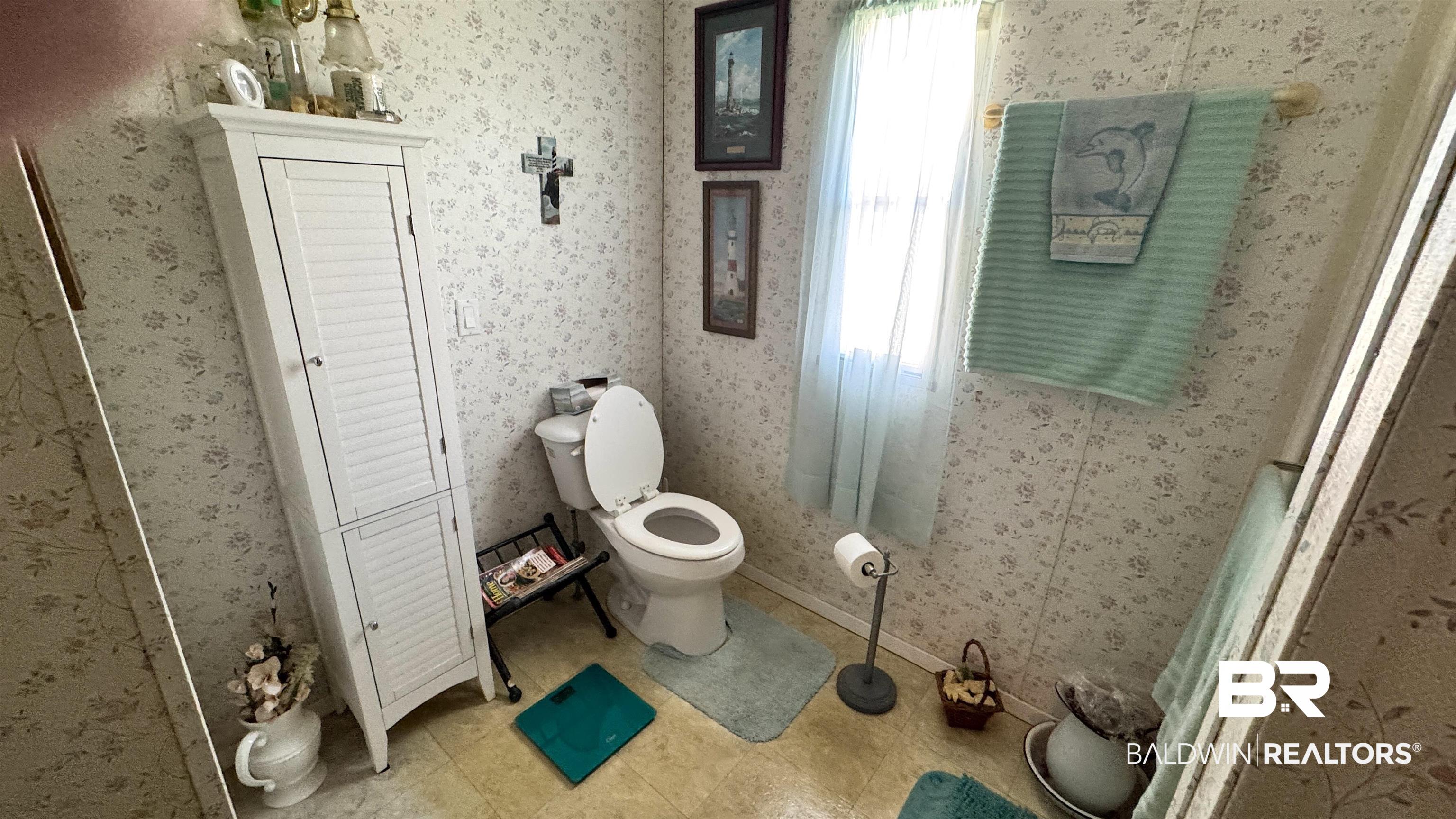 17897 Little Rock Road Foley, AL 36535 - Photo 10 of 24 Bathroom with toilet and baseboards