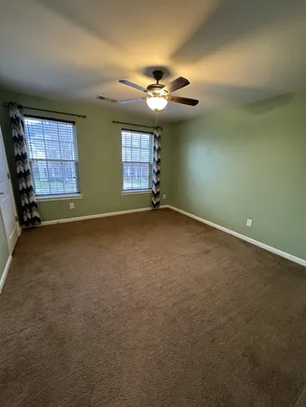 a view of storage and utility room with racks on the wall