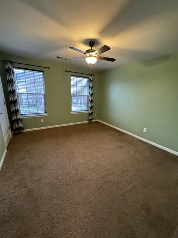 a view of storage and utility room with racks on the wall