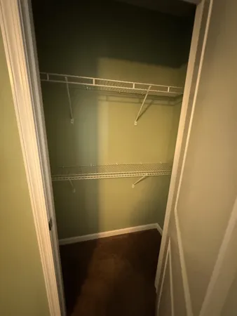 a view of a livingroom with a ceiling fan and window