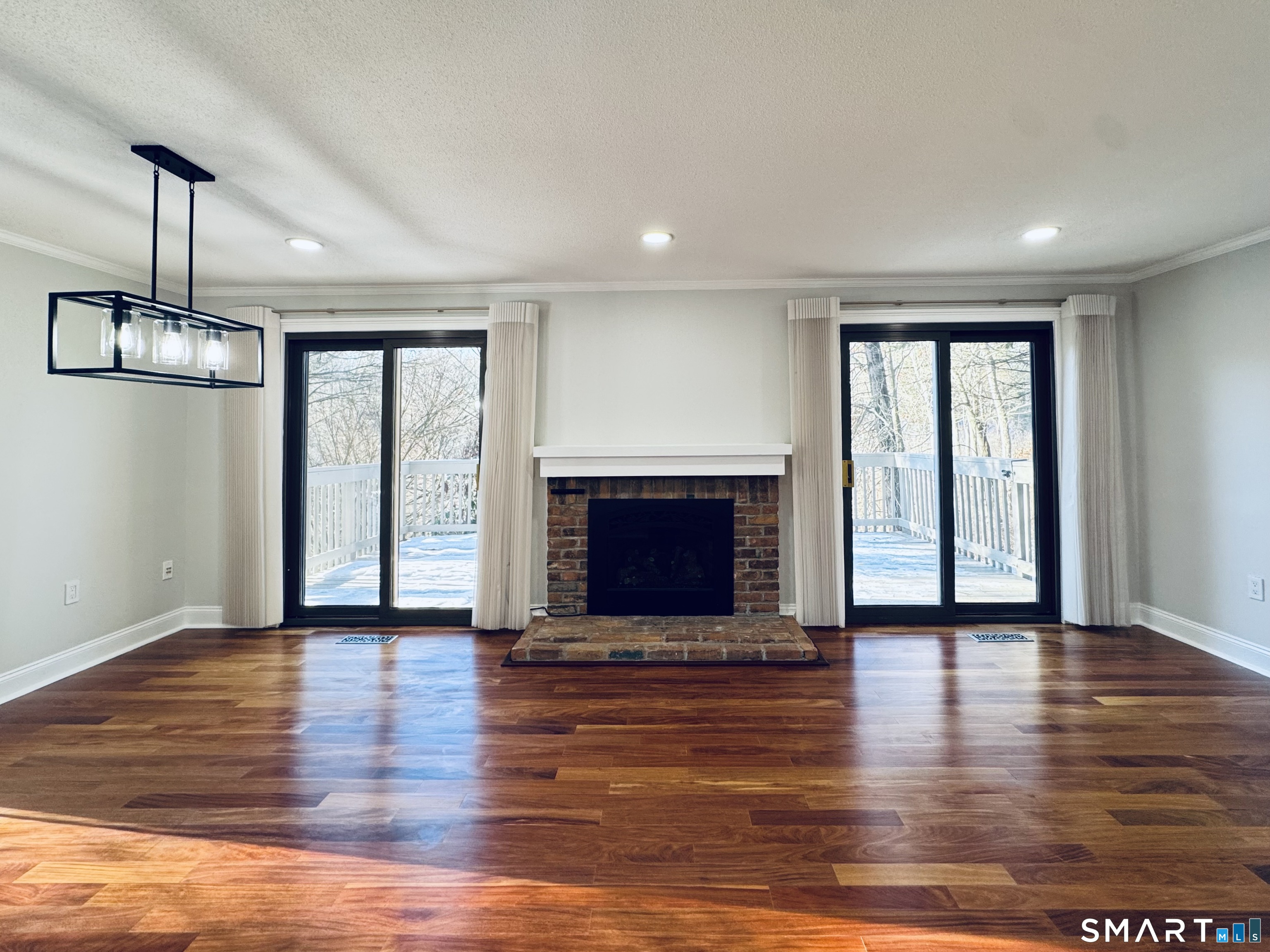 2 Highland Square, Unit 2 Avon, CT 06001 - Photo 12 of 40 a view of an empty room with wooden floor and a window