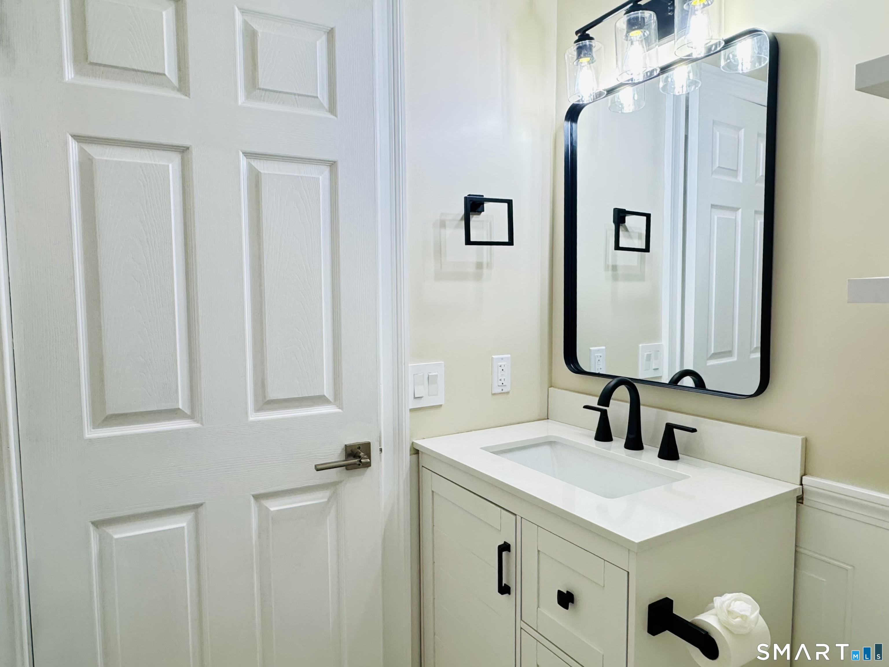 2 Highland Square, Unit 2 Avon, CT 06001 - Photo 18 of 40 a bathroom with a sink and a mirror
