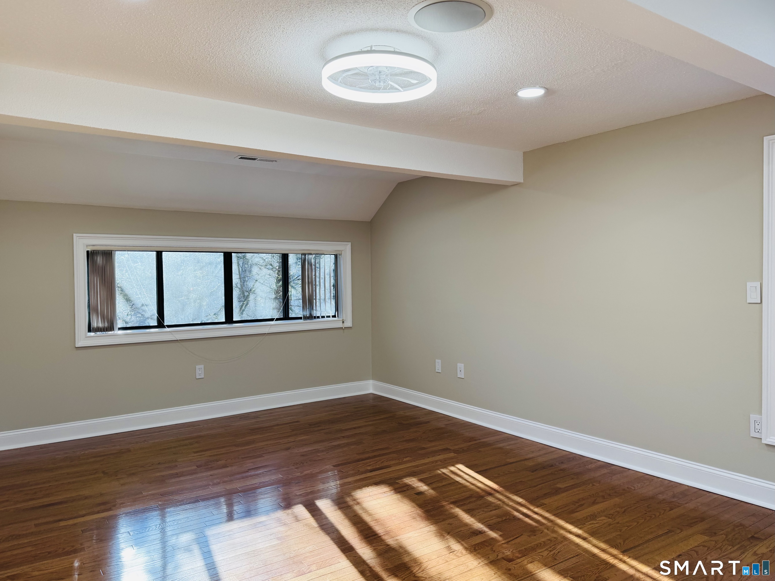 2 Highland Square, Unit 2 Avon, CT 06001 - Photo 24 of 40 a view of a room with wooden floor and window
