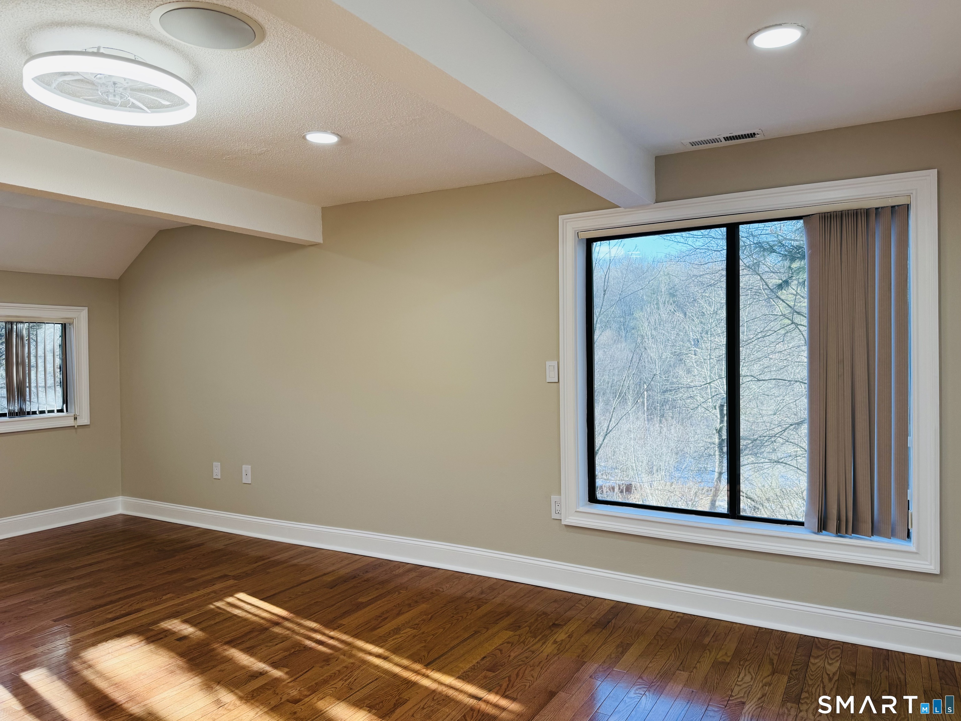2 Highland Square, Unit 2 Avon, CT 06001 - Photo 27 of 40 a view of a room with wooden floor and window