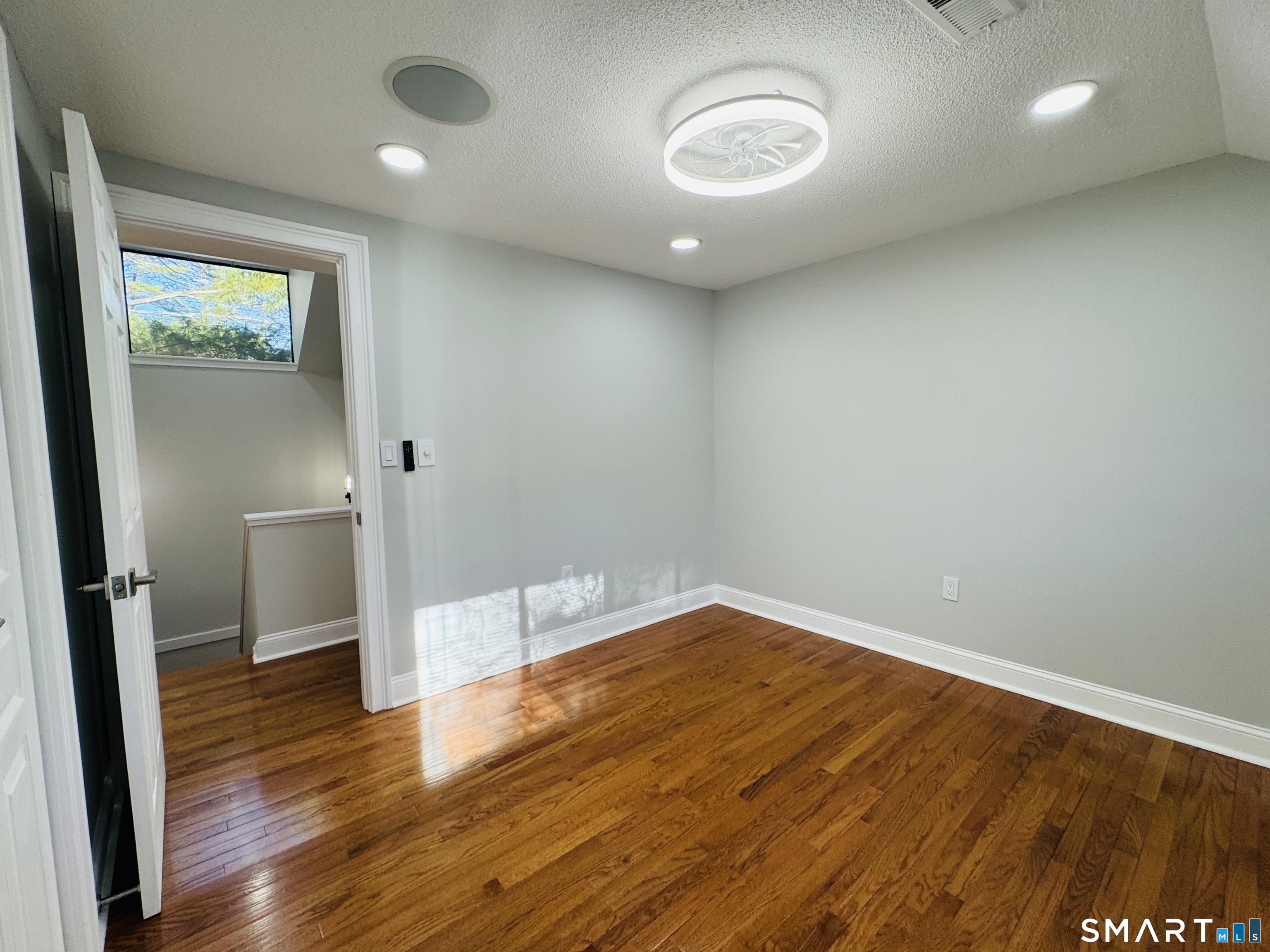 2 Highland Square, Unit 2 Avon, CT 06001 - Photo 29 of 40 a view of empty room with wooden floor