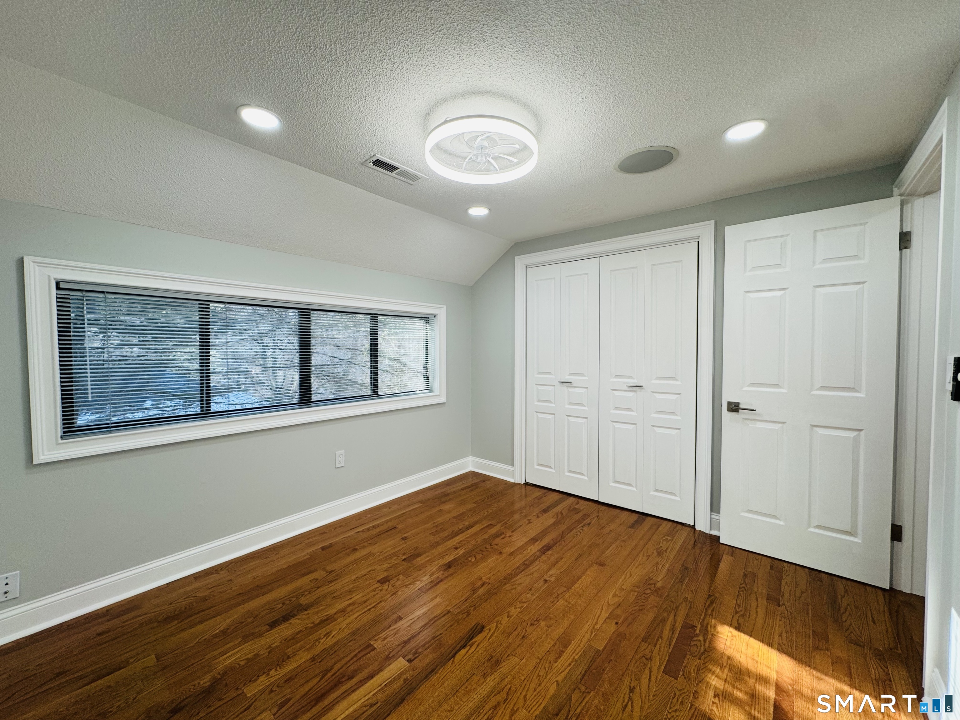 2 Highland Square, Unit 2 Avon, CT 06001 - Photo 30 of 40 a view of empty room with wooden floor and fan
