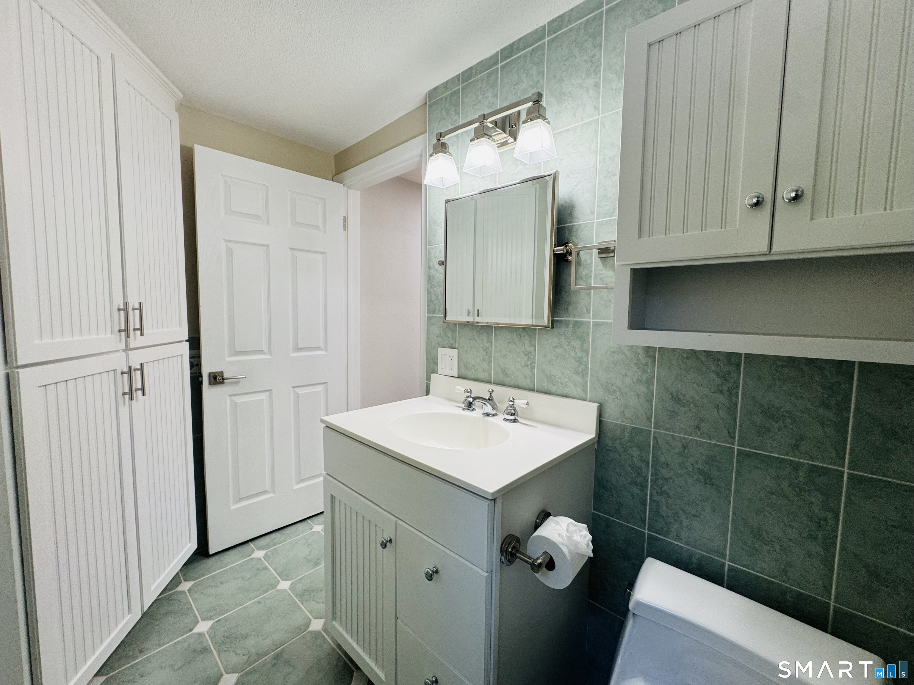 2 Highland Square, Unit 2 Avon, CT 06001 - Photo 35 of 40 a bathroom with a sink toilet and shower