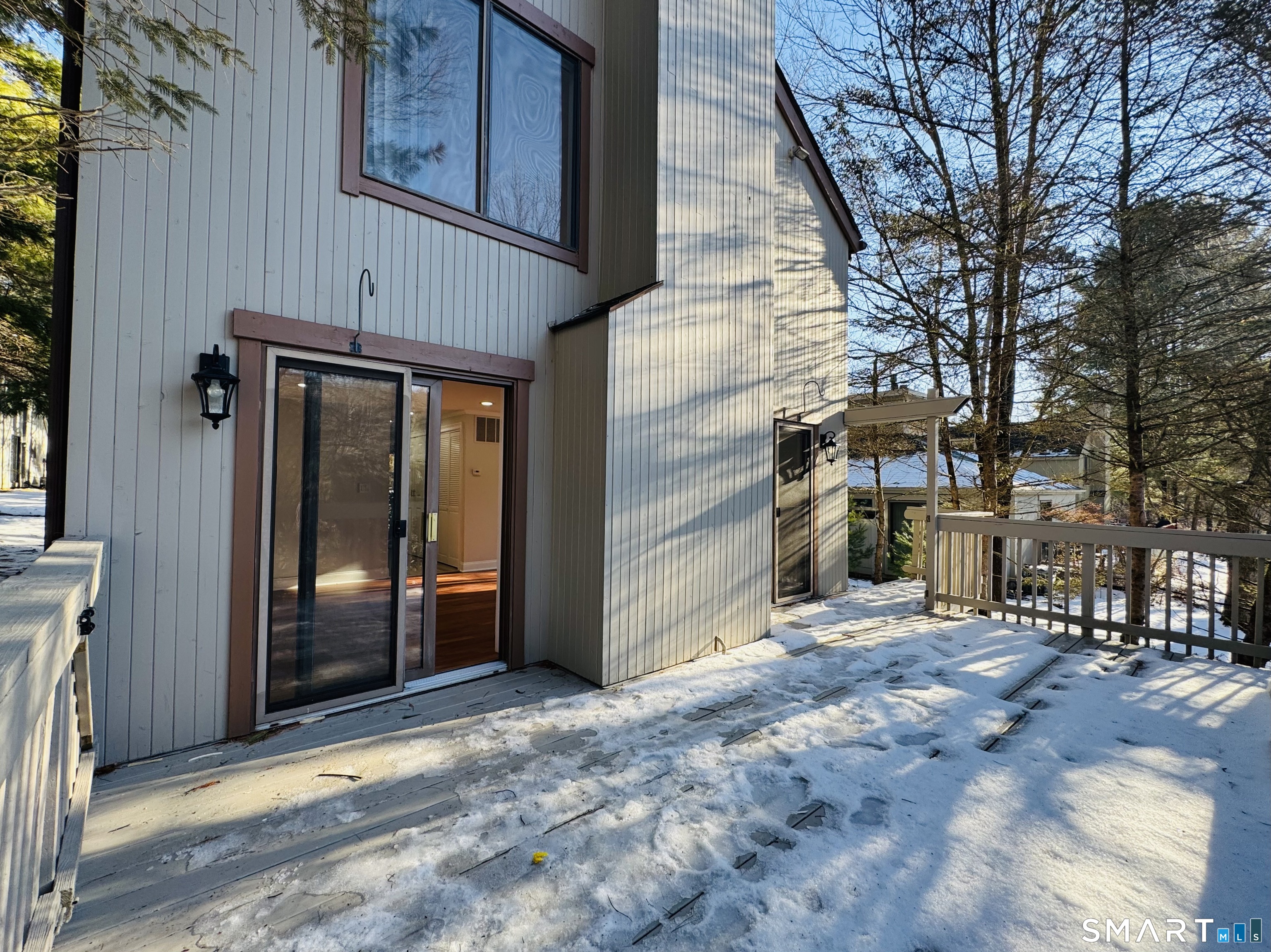 2 Highland Square, Unit 2 Avon, CT 06001 - Photo 36 of 40 a view of a house with a wooden fence