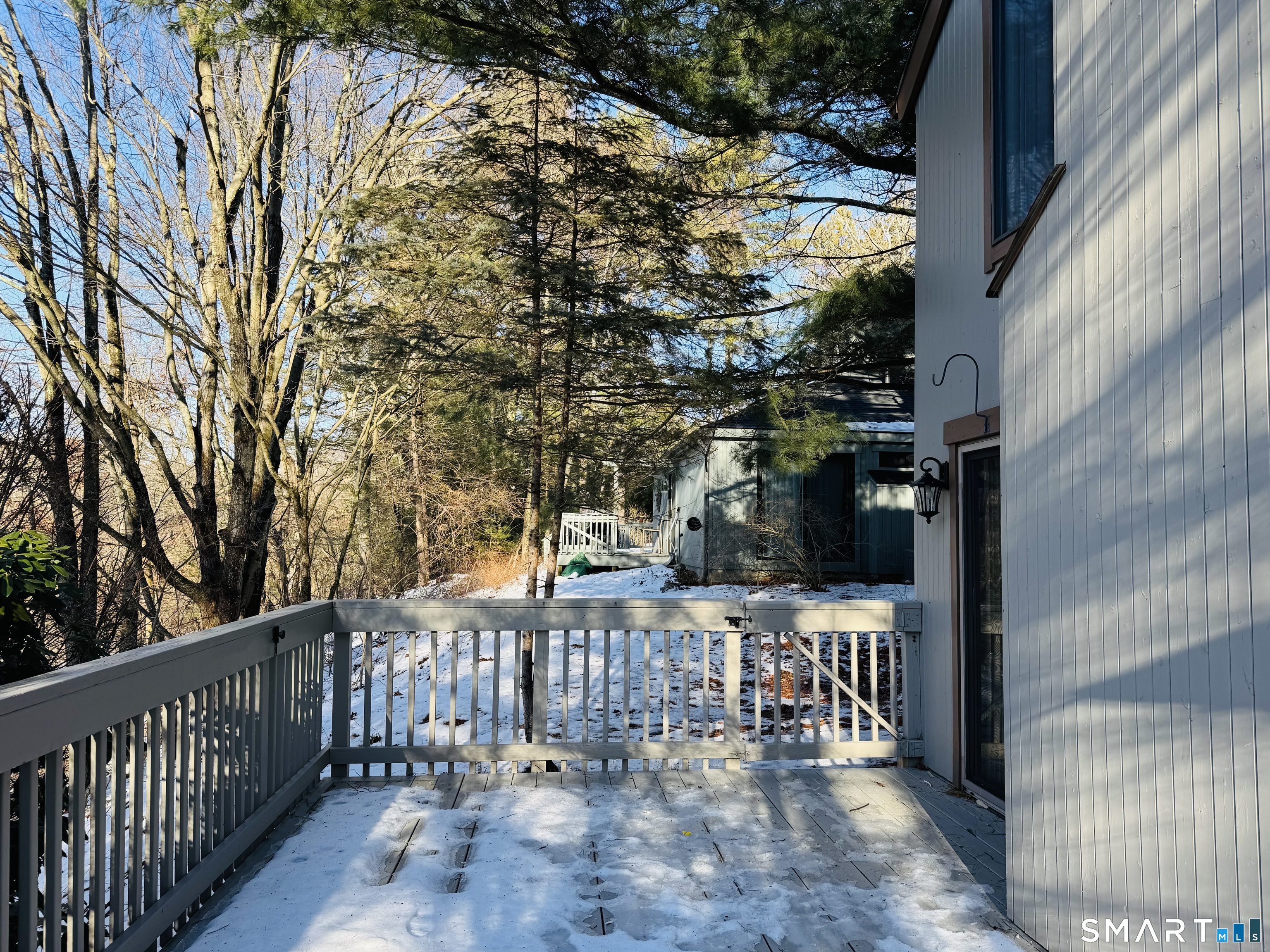 2 Highland Square, Unit 2 Avon, CT 06001 - Photo 38 of 40 a view of a pathway of a house with wooden fence