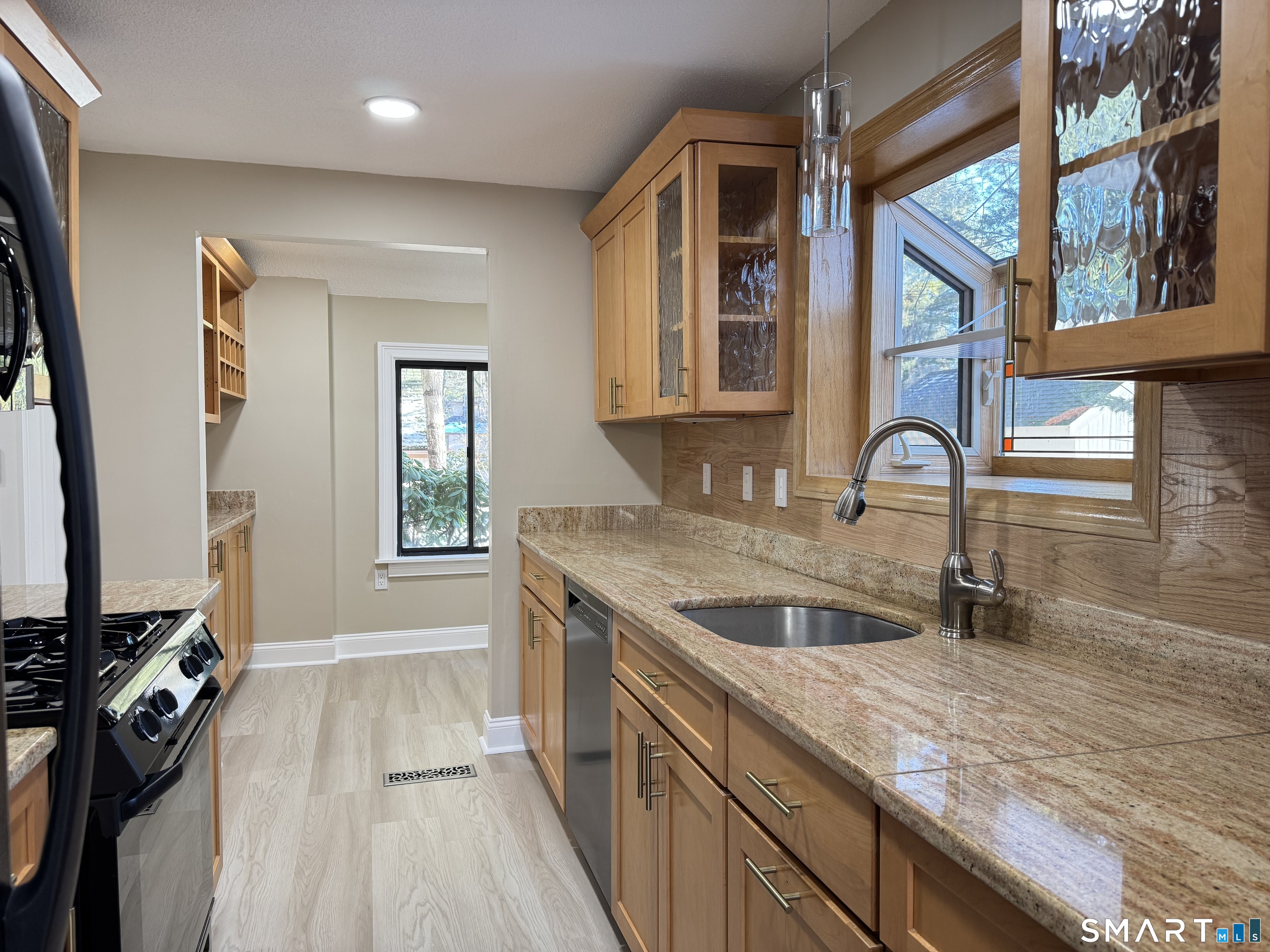 2 Highland Square, Unit 2 Avon, CT 06001 - Photo 7 of 40 a kitchen with a sink and a stove top oven