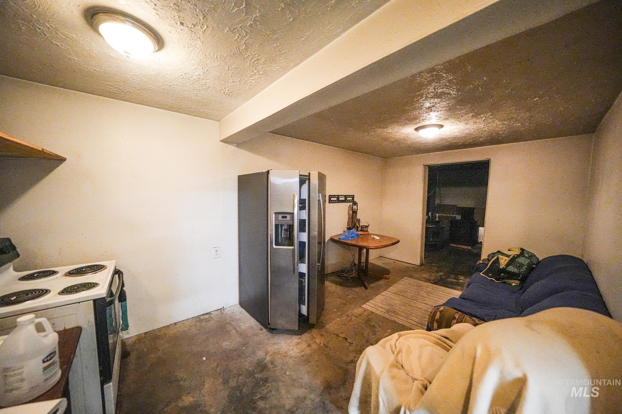 10 Main Street South Pierce, ID 83546 - Photo 21 of 27 Rec room with unfinished concrete flooring and a textured ceiling