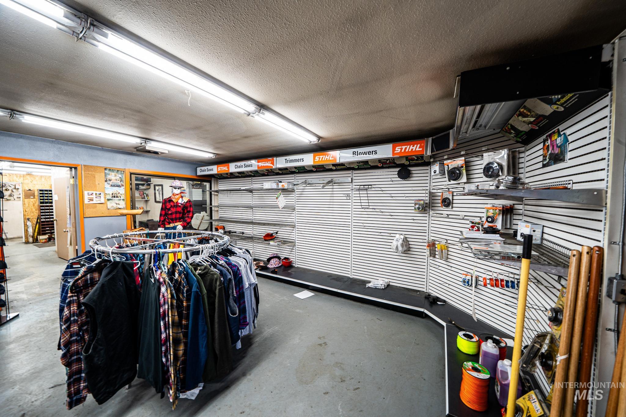10 Main Street South Pierce, ID 83546 - Photo 6 of 27 Miscellaneous room with a garage, a textured ceiling, and a workshop area