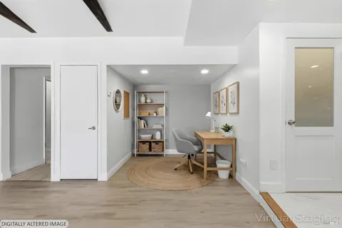 a workspace with wooden floor and furniture