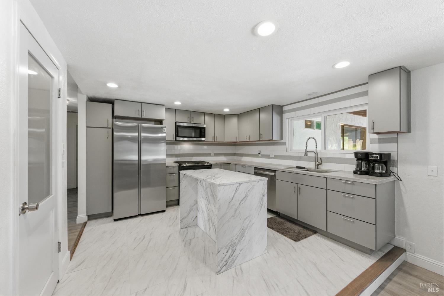 5174 Blank Road Sebastopol, CA 95472 - Photo 16 of 48 a kitchen with counter top space cabinets and stainless steel appliances