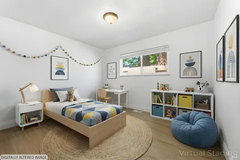 a bedroom with a bed and a couch