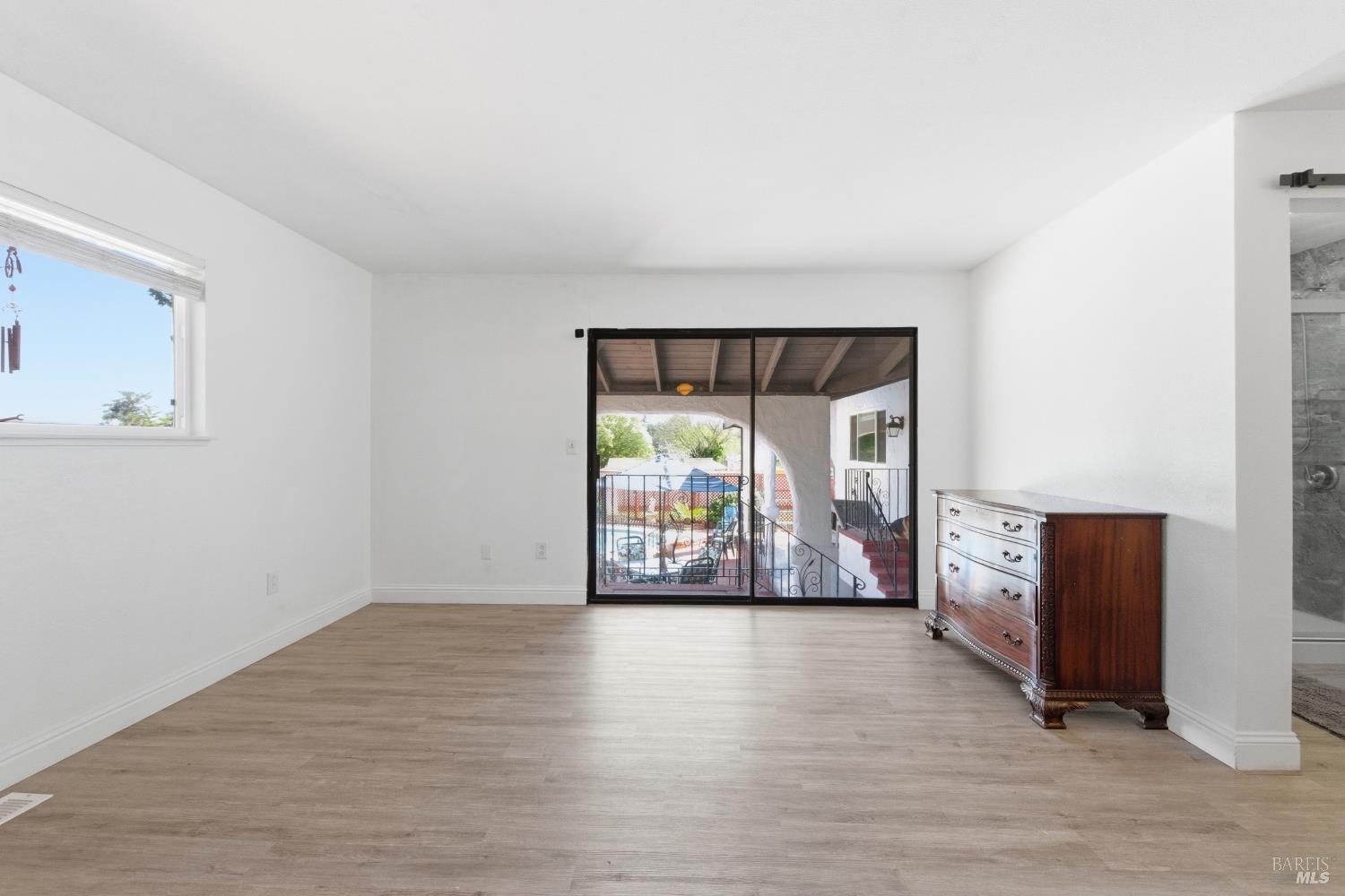 5174 Blank Road Sebastopol, CA 95472 - Photo 22 of 48 a view of an empty room with window and wooden floor