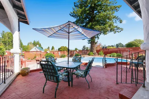 an outdoor space with furniture and umbrella