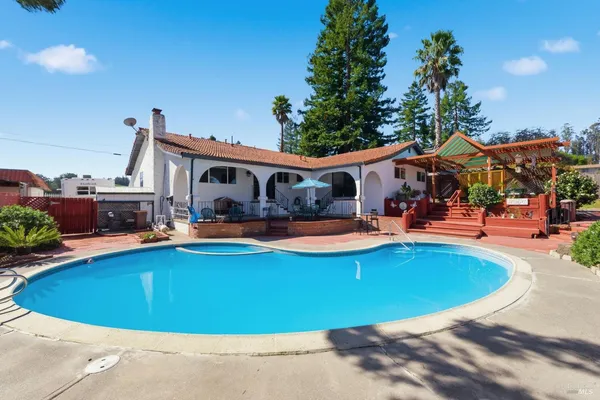 a view of outdoor space with swimming pool and patio