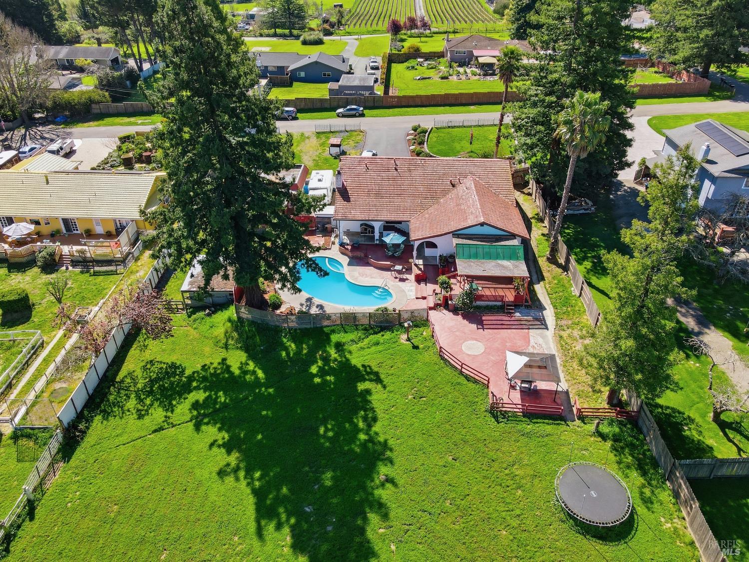 5174 Blank Road Sebastopol, CA 95472 - Photo 44 of 48 an aerial view of a house with swimming pool a yard and lake view