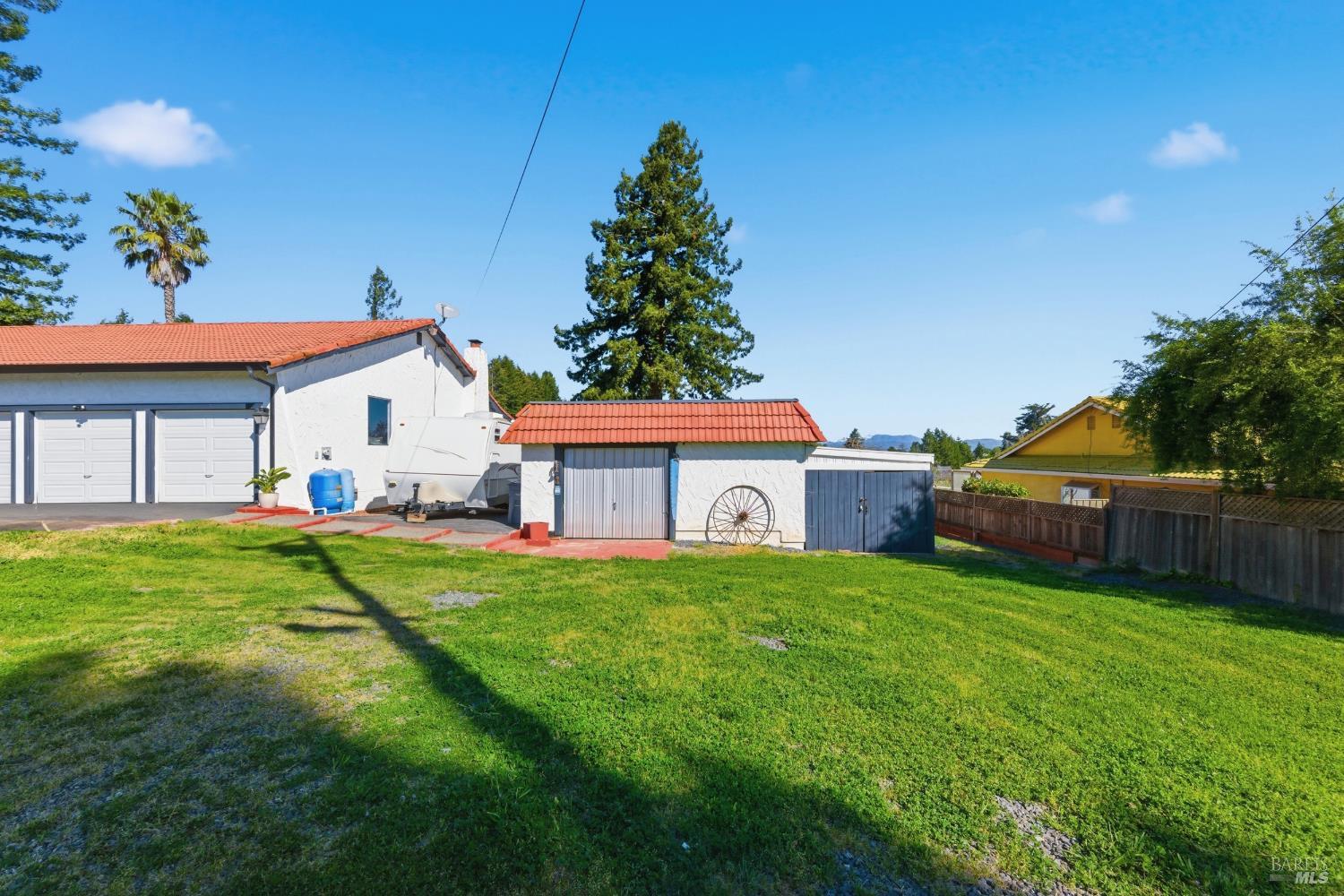5174 Blank Road Sebastopol, CA 95472 - Photo 5 of 48 a front view of a house with a yard and garage