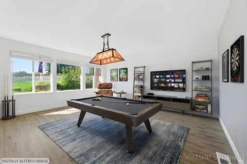 a view of a livingroom with furniture and window