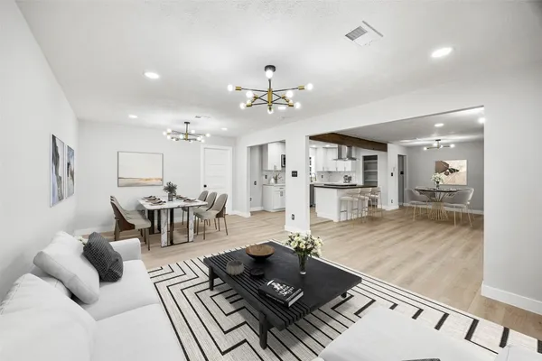 a kitchen with stainless steel appliances granite countertop a sink and a stove top oven