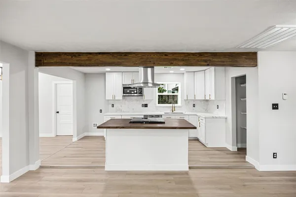 a kitchen with a stove and a refrigerator