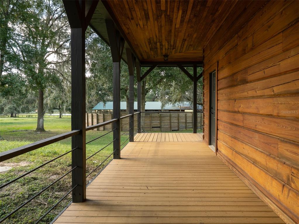12100 Northwest 110th Avenue Reddick, FL 32686 - Photo 25 of 38 a view of porch with a swimming pool