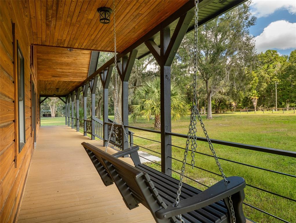 12100 Northwest 110th Avenue Reddick, FL 32686 - Photo 5 of 38 a view of a chairs and table on the wooden floor