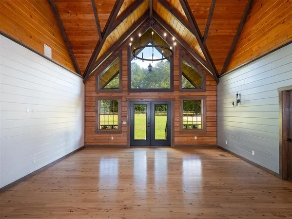 a view of an entryway with wooden floor and a fire pit