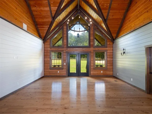 a view of an entryway with wooden floor and a fire pit