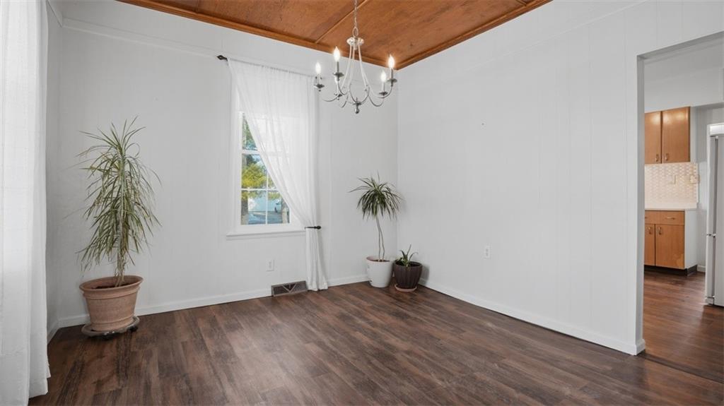 1105 Linden Street Monaca, PA 15061 - Photo 23 of 45 a view of empty room with window and wooden floor