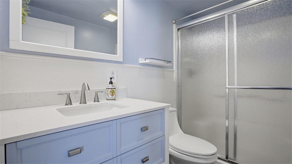 1105 Linden Street Monaca, PA 15061 - Photo 26 of 45 a bathroom with a sink a toilet and shower