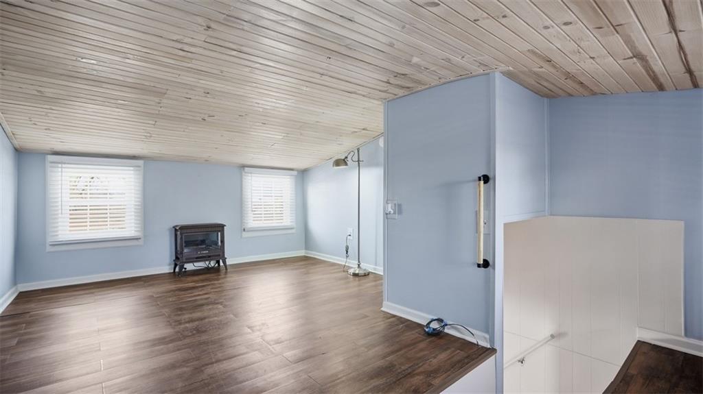 1105 Linden Street Monaca, PA 15061 - Photo 35 of 45 an empty room with wooden floor and a window