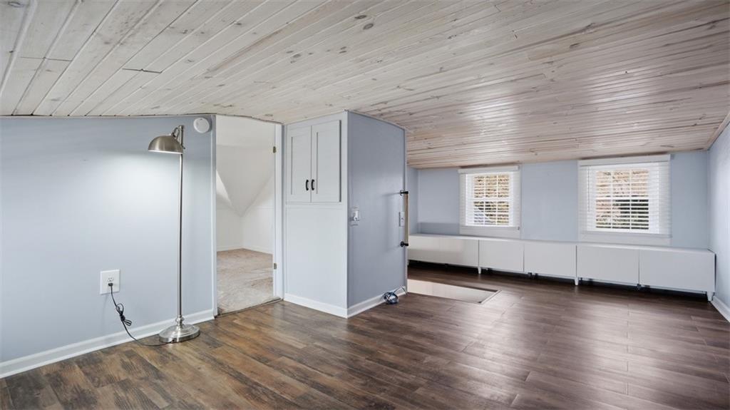 1105 Linden Street Monaca, PA 15061 - Photo 36 of 45 an empty room with wooden floor and windows