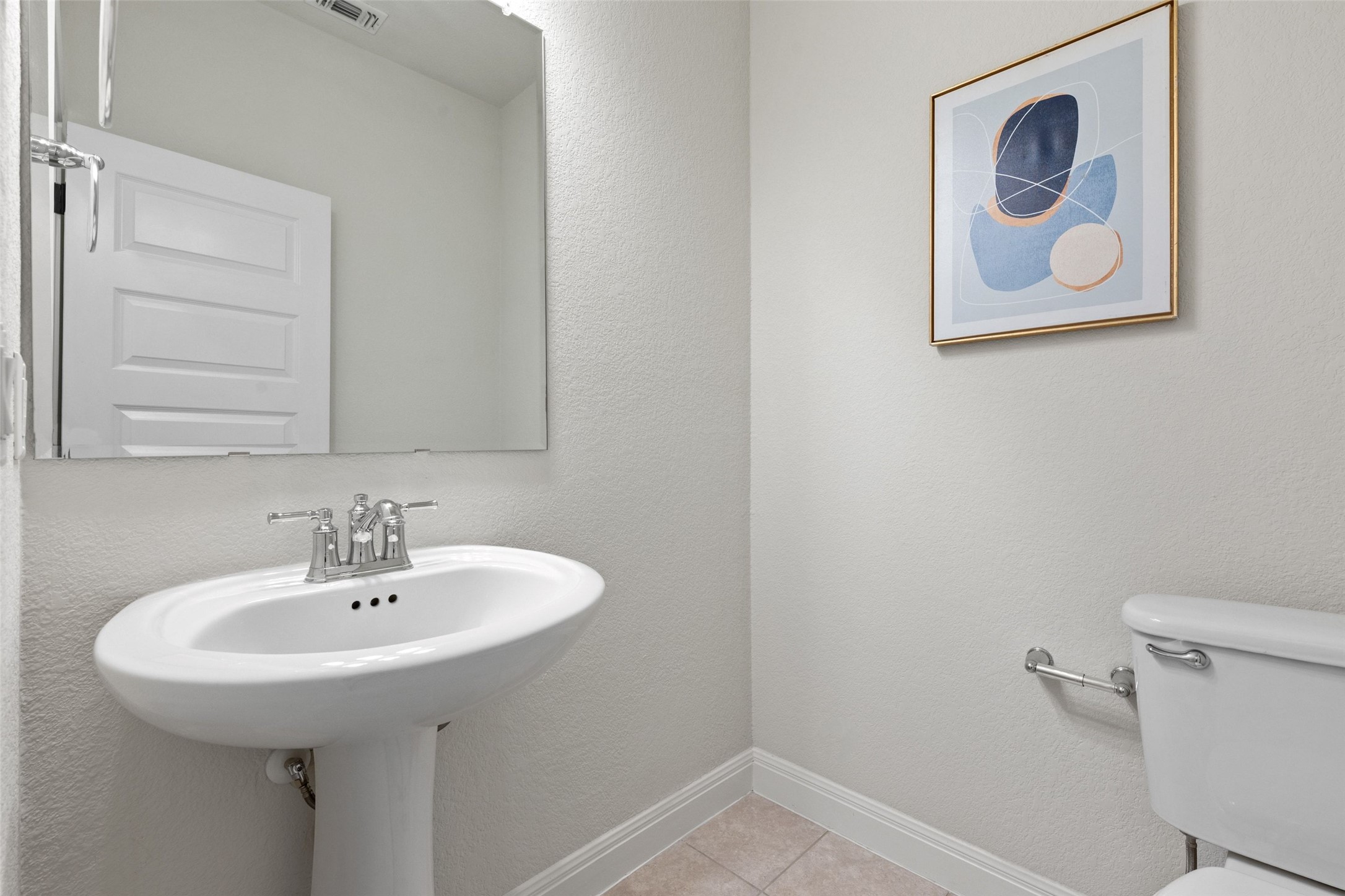 1513 Hinterwald Street Leander, TX 78641 - Photo 22 of 40 a bathroom with a sink and a toilet