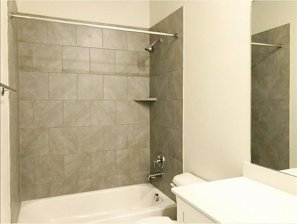 3817 Bennett Trail Celina, TX 75009 - Photo 12 of 22 a bathroom with a bathtub and sink
