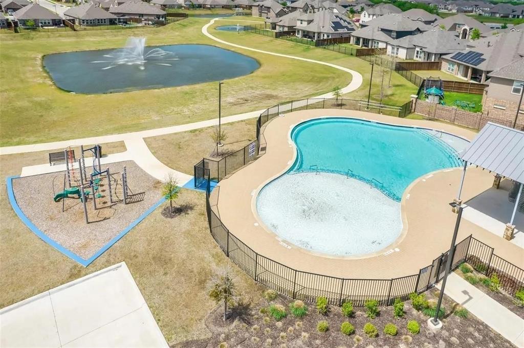 3817 Bennett Trail Celina, TX 75009 - Photo 17 of 22 a view of a swimming pool with a patio