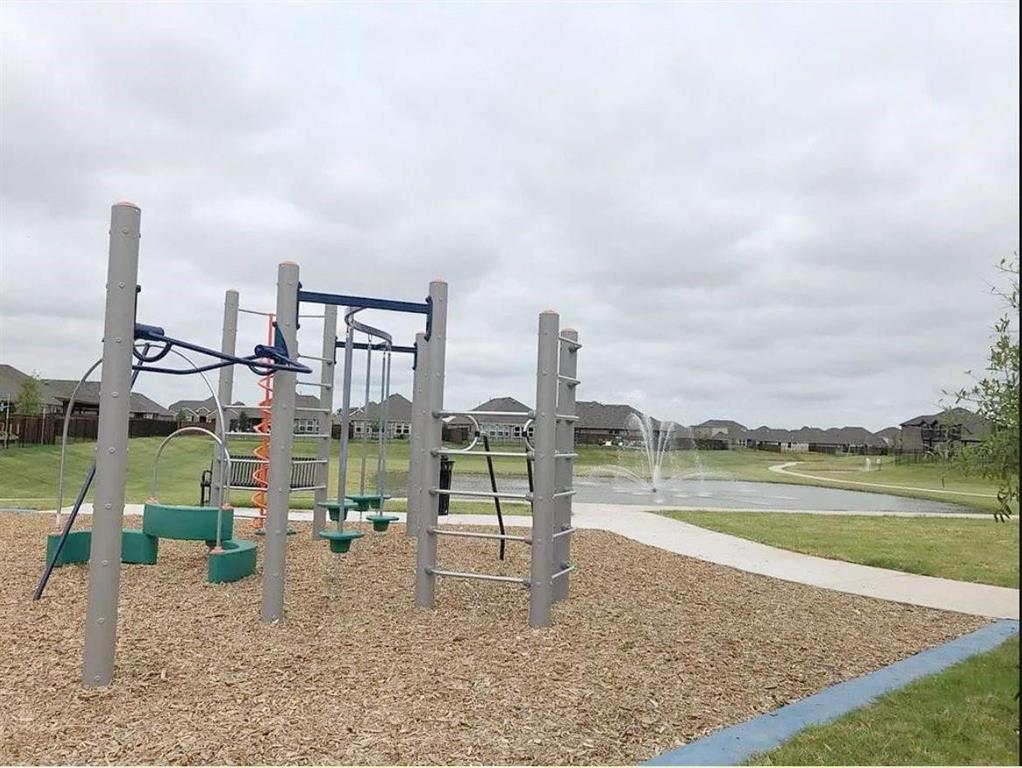 3817 Bennett Trail Celina, TX 75009 - Photo 21 of 22 a view of a lake with a city from a terrace