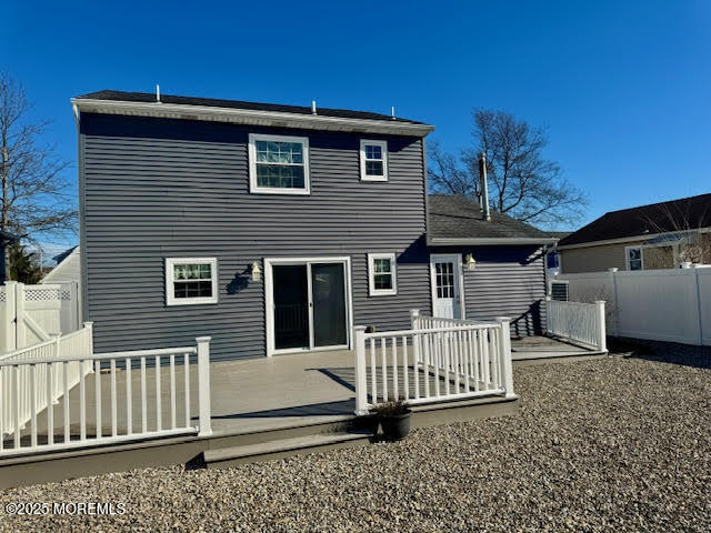 38 Cabana Drive Brick, NJ 08723 - Photo 17 of 19 a view of a house with a small yard and wooden fence