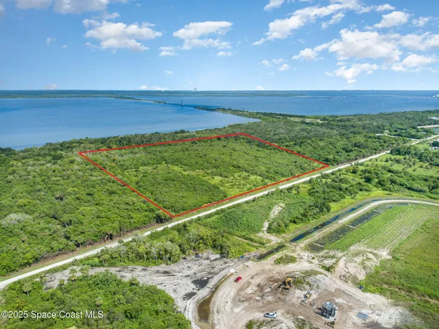 a view of a lake with a big yard