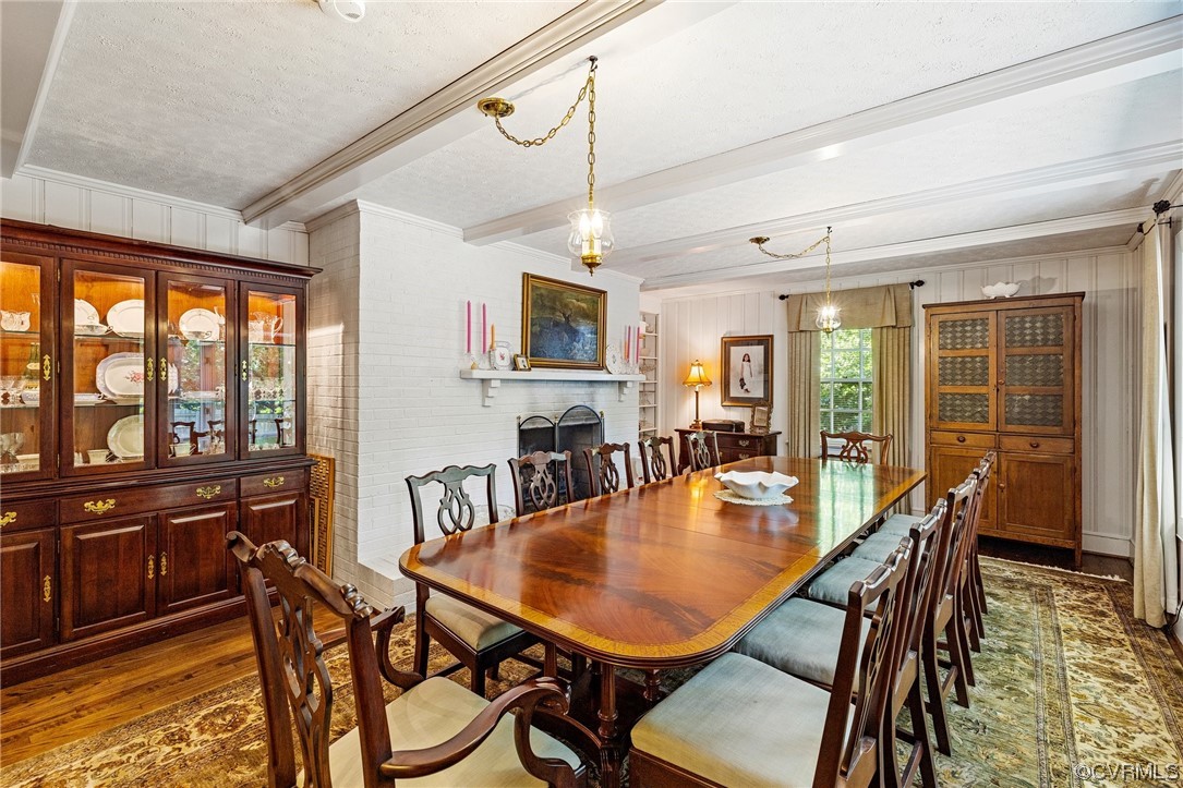 2731 Arrandell Road Midlothian, VA 23113 - Photo 18 of 30 a dining room with furniture a chandelier and wooden floor